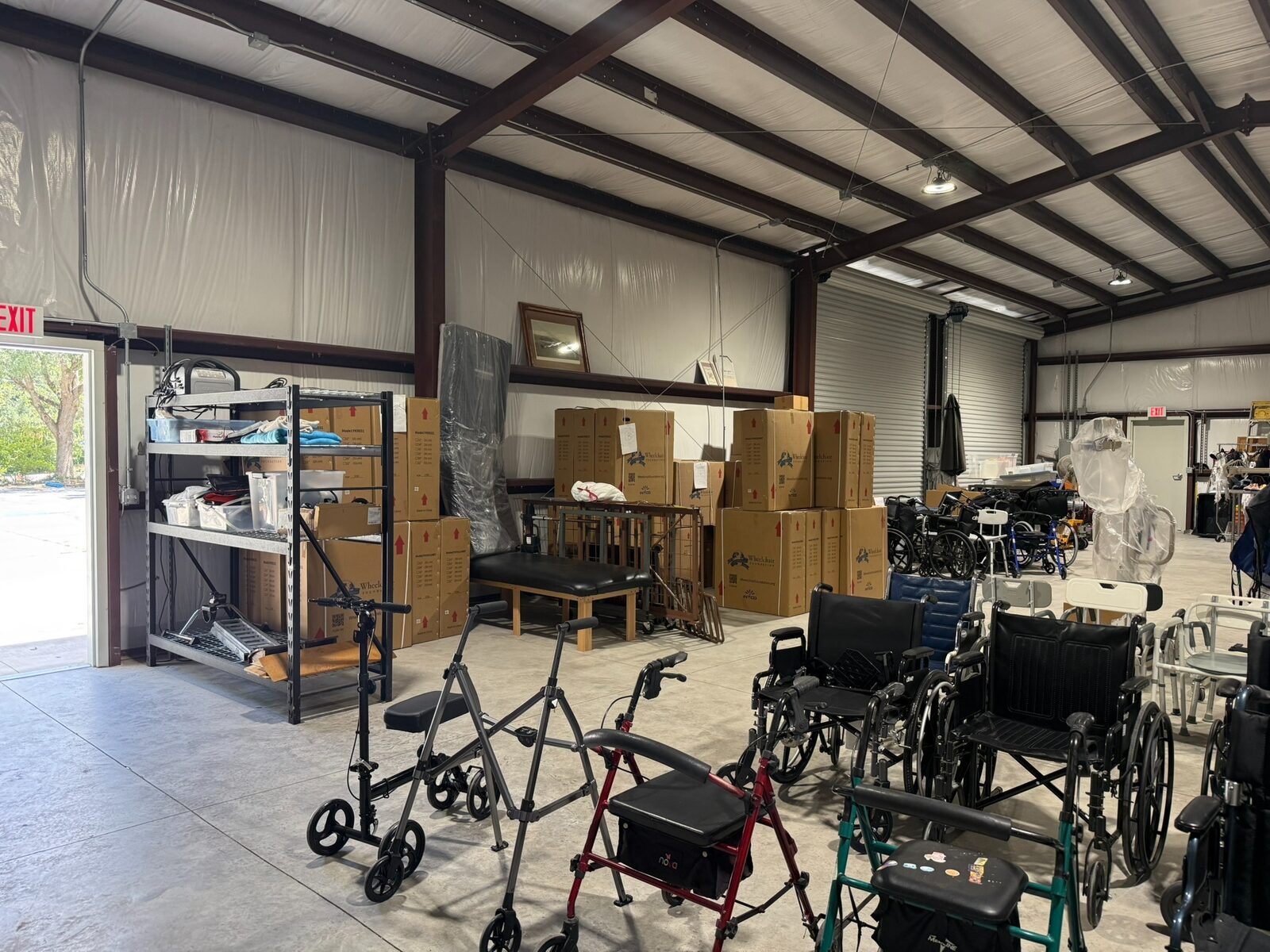 Walkers, wheelchairs and boxed equipment inside the PVACF warehouse